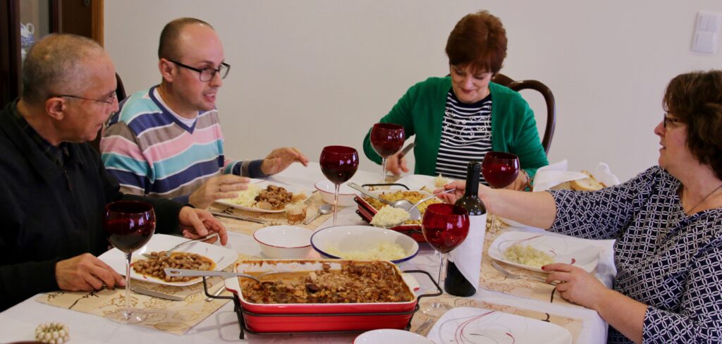 our neighbors and a priest from Biscoitos dined together and blessed our new home