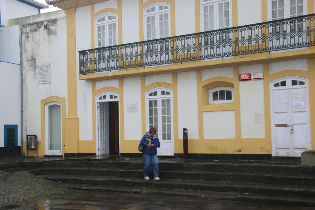 Sofia on steps to her old school, now the Praia Public Library