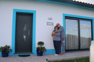 Sofia and Rick by new Azorean nameplate at front door