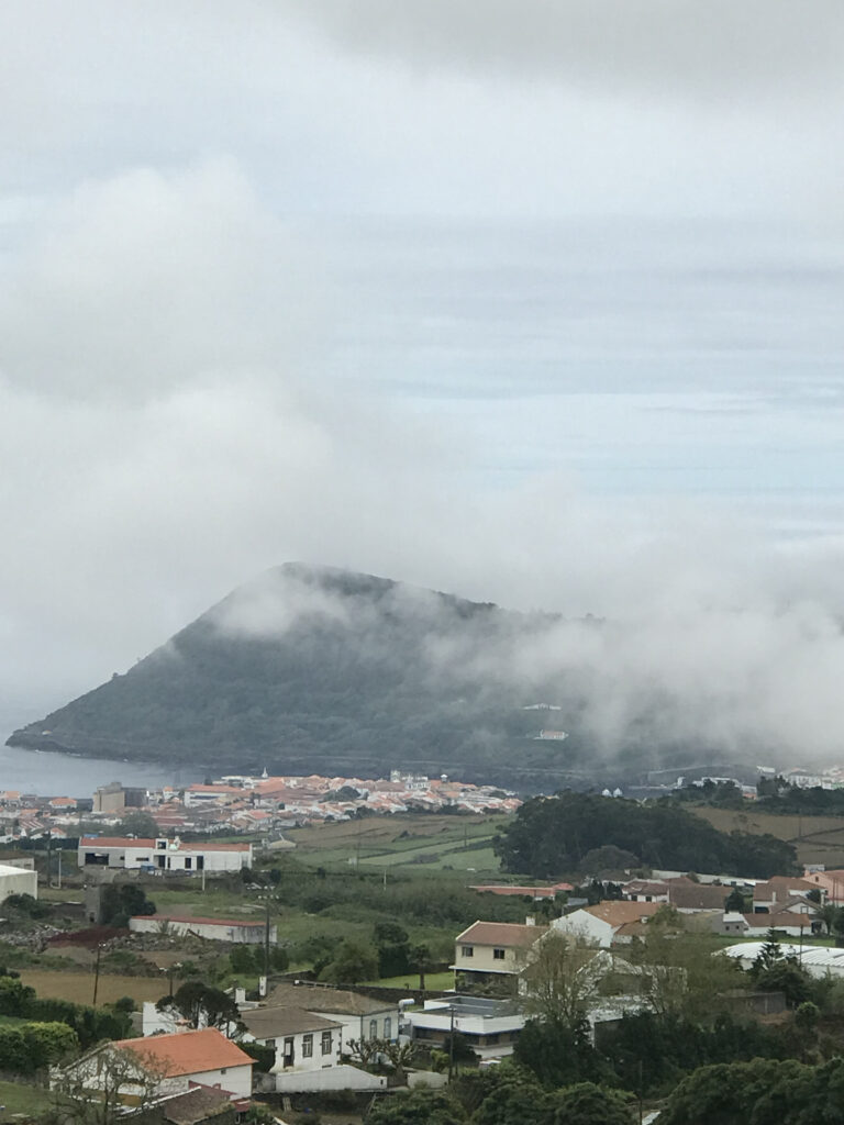 distant photo of volcano overlooking Angra do Heroismo on Terceira Island.