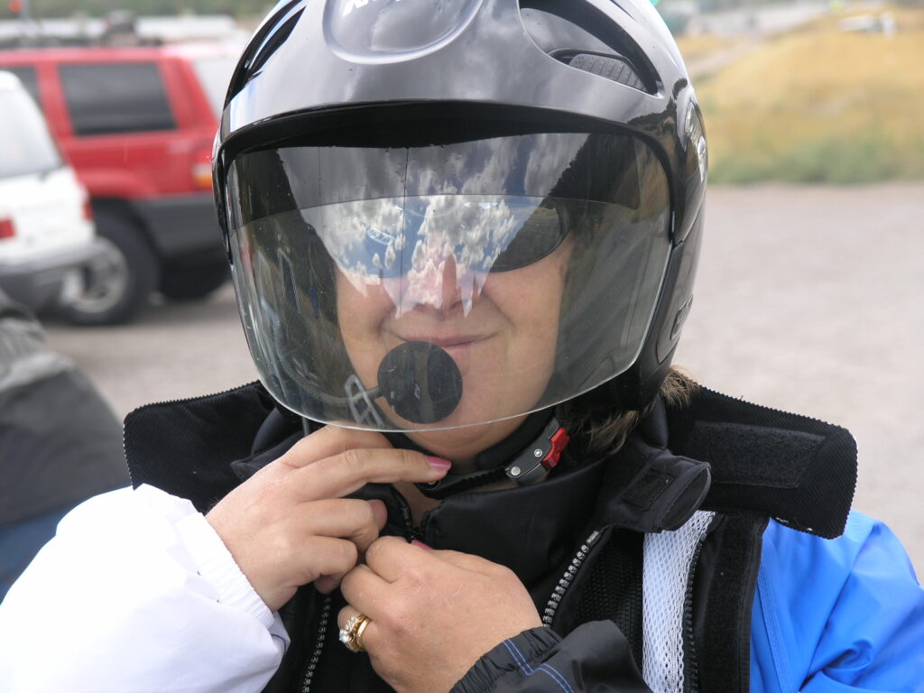 Wife wearing motorcycle helmet in Wyoming on a trip from Michigan some years back.