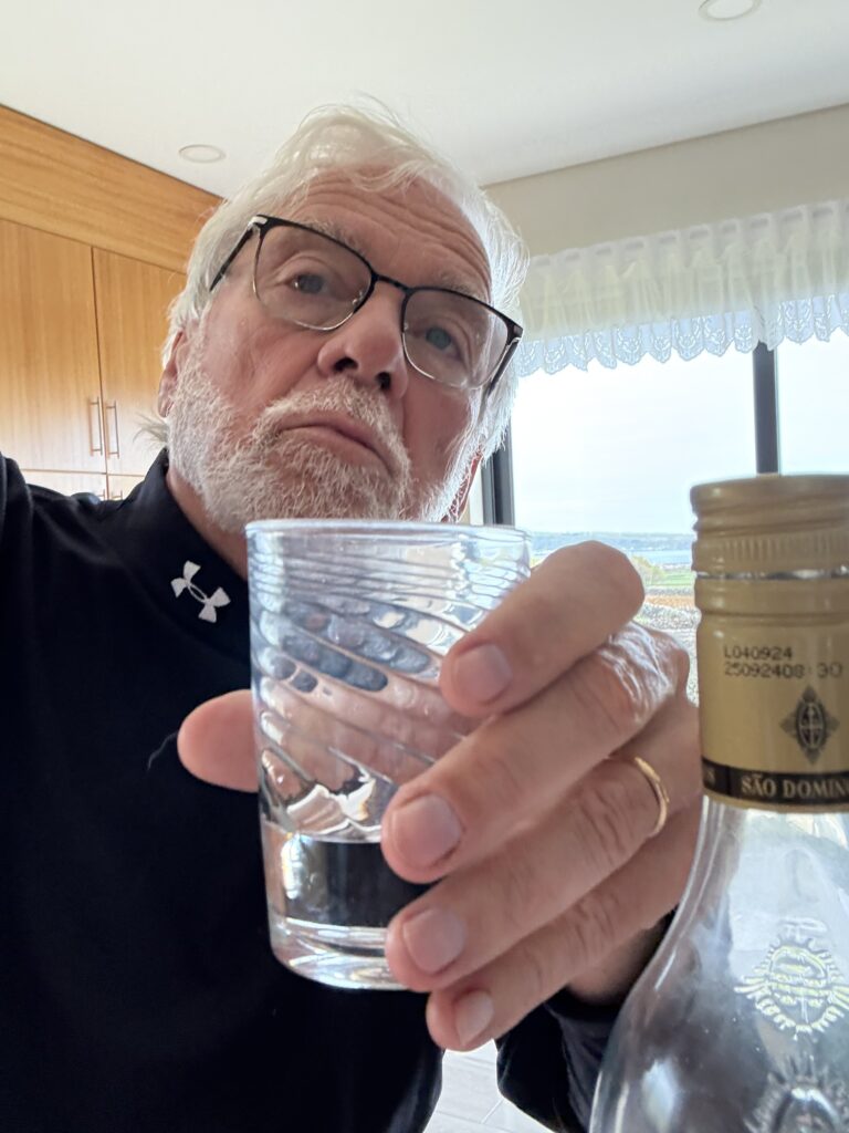 Rick drinking Aguar Dente depressed at US news