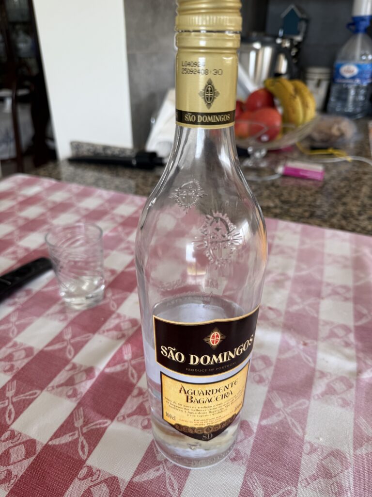 Bottle of local liquor, Aguar Dente
