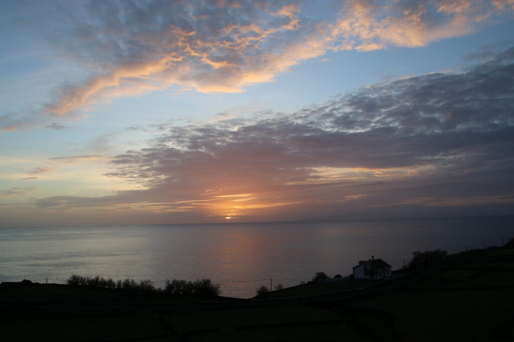 Sunset with Islands in the distance and clouds and sky even further...and then the sun